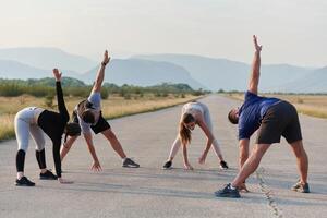 Diverse Group of Athletes Prepare Together for a Run photo