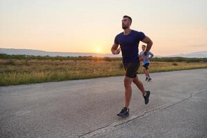 Marathon Partners. Two Athletic Friends Training Together for Upcoming Competition. photo