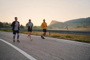 Running towards a common goal, a group of colleagues braves the misty morning air, their determination evident in every stride. photo