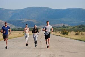 A group of friends maintains a healthy lifestyle by running outdoors on a sunny day, bonding over fitness and enjoying the energizing effects of exercise and nature photo