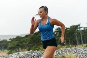 Unstoppable. A Determined Athlete Trains Through the Rain in Pursuit of Marathon Glory photo