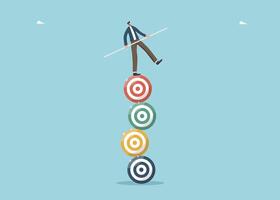 Man holding balance on stack of dart boards vector