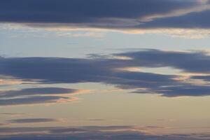 Beautiful red and blue clouds in the evening. A beautiful sunset with clouds. photo