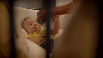 Mother Feeding Young Baby Infant Child Lying in Crib at Home video