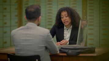 Multi Ethnic Group of Two People Having a Business Sales Meeting Inside Bank video