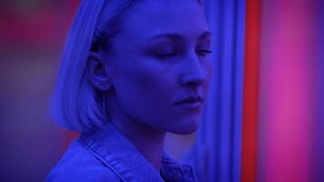 Young Blond Woman Exploring Room of Mirrors in Dreamlike Fantasy Neon Light video