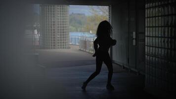 Happy Young Woman with Curly Hair Dancing on City Street in Slow Motion video