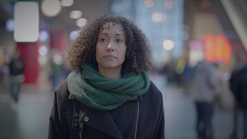 Thoughtful Woman with Braun Curly Hair Commuting in the City at Night video