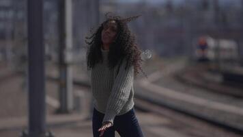Happy Young Woman with Curly Hair Dancing on City Street in Slow Motion video