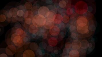 Abstract bokeh light blurs in multiple colors on dark background, creating serene atmosphere video