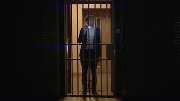 Suspenseful Investigator with Flashlight in a Dark Jail Cell, Ready for Crime Investigation video