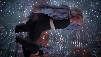 Young Blond Woman Exploring Room of Mirrors in Dreamlike Fantasy Neon Light video