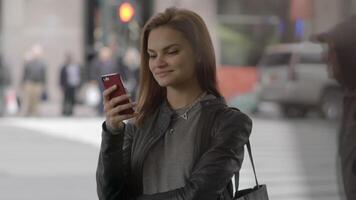 Young Beautiful Caucasian Woman Using Smart Phone in the City video