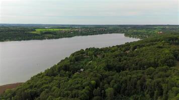 Drone view Pilsensee See in Bayern, Seefeld, Hechendorf Deutschland Luftaufnahme. Aerial view of lake Pilsensee shared lake area with Lake Ammer in Bavaria, Germany near Munich. video