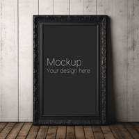 Mockup of black patterned frame for poster or photo on gray wall and brown flooring psd