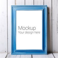 Mockup of blue wooden frame for poster or photo on white wooden background psd