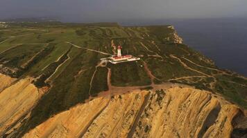 Cabo Espichel in Portugal. Cliffs, Lighthouse and Atlantic Ocean. Aerial View. Drone Moves Forward, Tilt Down video