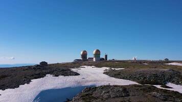 Torre Mountain Peak on Sunny Day. Serra Da Estrela. Highest Point of Continental Portugal. Aerial View. Drone Moves Upwards, Tilt Down video