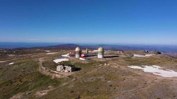 Torre Mountain Peak on Sunny Day. Serra Da Estrela. Highest Point of Continental Portugal. Aerial View. Drone Moves Backwards and Upwards video