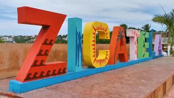 Puerto Escondido Oaxaca Mexico 2022 Colorful Zicatela Puerto Escondido lettering sign symbol on beach Mexico. video