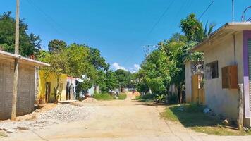 Puerto Escondido Oaxaca Mexico 2022 Colorful street with houses palms cars jungle Puerto Escondido Mexico. video