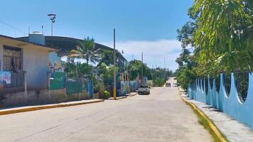 Puerto Escondido Oaxaca Mexico 2022 Colorful street with houses palms cars jungle Puerto Escondido Mexico. video