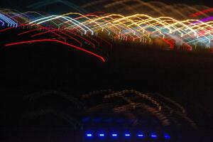 Abstract blurry background with pattern from colorful traces photo