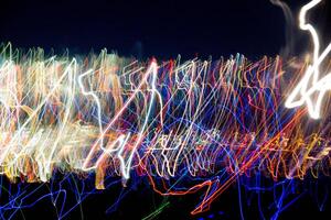 Abstract blurry background with pattern from colorful traces photo