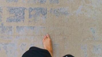 Walking on the pavement rocks stones feet barefoot in Mexico. video