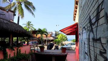 Puerto Escondido Oaxaca Mexico 2022 Typical beautiful colorful tourist street sidewalk city Puerto Escondido Mexico. video