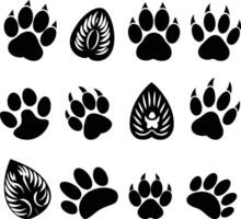set of black silhouettes of different animal paw vector