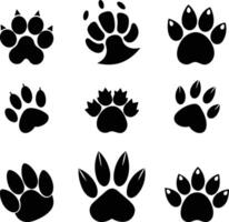 set of black silhouettes of different animal paw vector