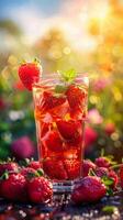 Tall Glass Filled With Drink Surrounded by Strawberries photo