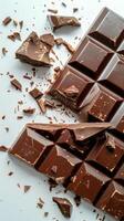 A Pile of Chocolate on Top of a White Table photo