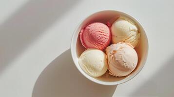 Three Scoops of Ice Cream in a Bowl on a Marble Table photo