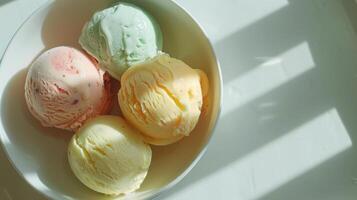 Three Scoops of Ice Cream in a Bowl on a Marble Table photo