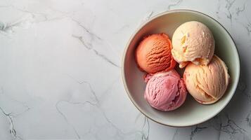 Three Scoops of Ice Cream in a Bowl on a Marble Table photo