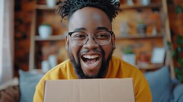 Man in Yellow Shirt Holding Cardboard Box photo