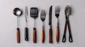 Group of Forks and Spoons Arranged Neatly photo
