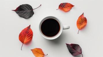 un taza de café rodeado por otoño hojas foto