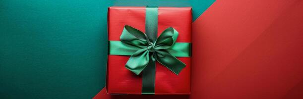 Red Gift Box With Green Bow on Green and Red Background photo