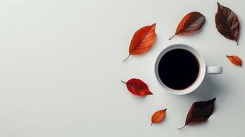 un taza de café rodeado por otoño hojas foto