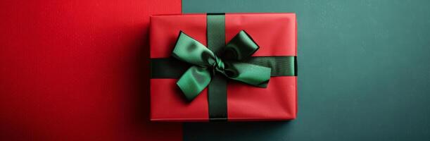 Red Gift Box With Green Bow on Green and Red Background photo