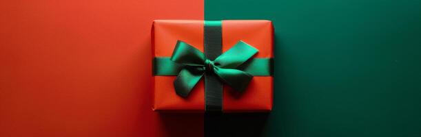 Red Gift Box With Green Bow on Green and Red Background photo