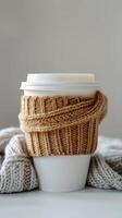 Cup of Coffee With Knitted Wrap photo