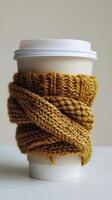 Cup of Coffee With Knitted Wrap photo