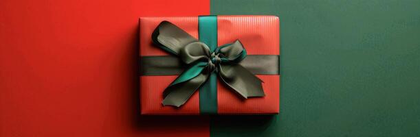 Red Gift Box With Green Bow on Green and Red Background photo