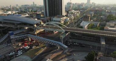 Aerial view of Bangkok downtown, Sky train station, Cars on traffic road and buildings, Thailand video