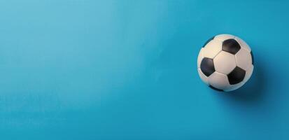 Black and White Soccer Ball on Blue Background photo