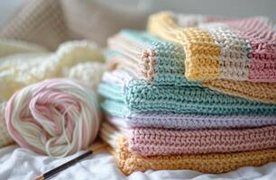 Pile of Crocheted Blankets on Bed photo